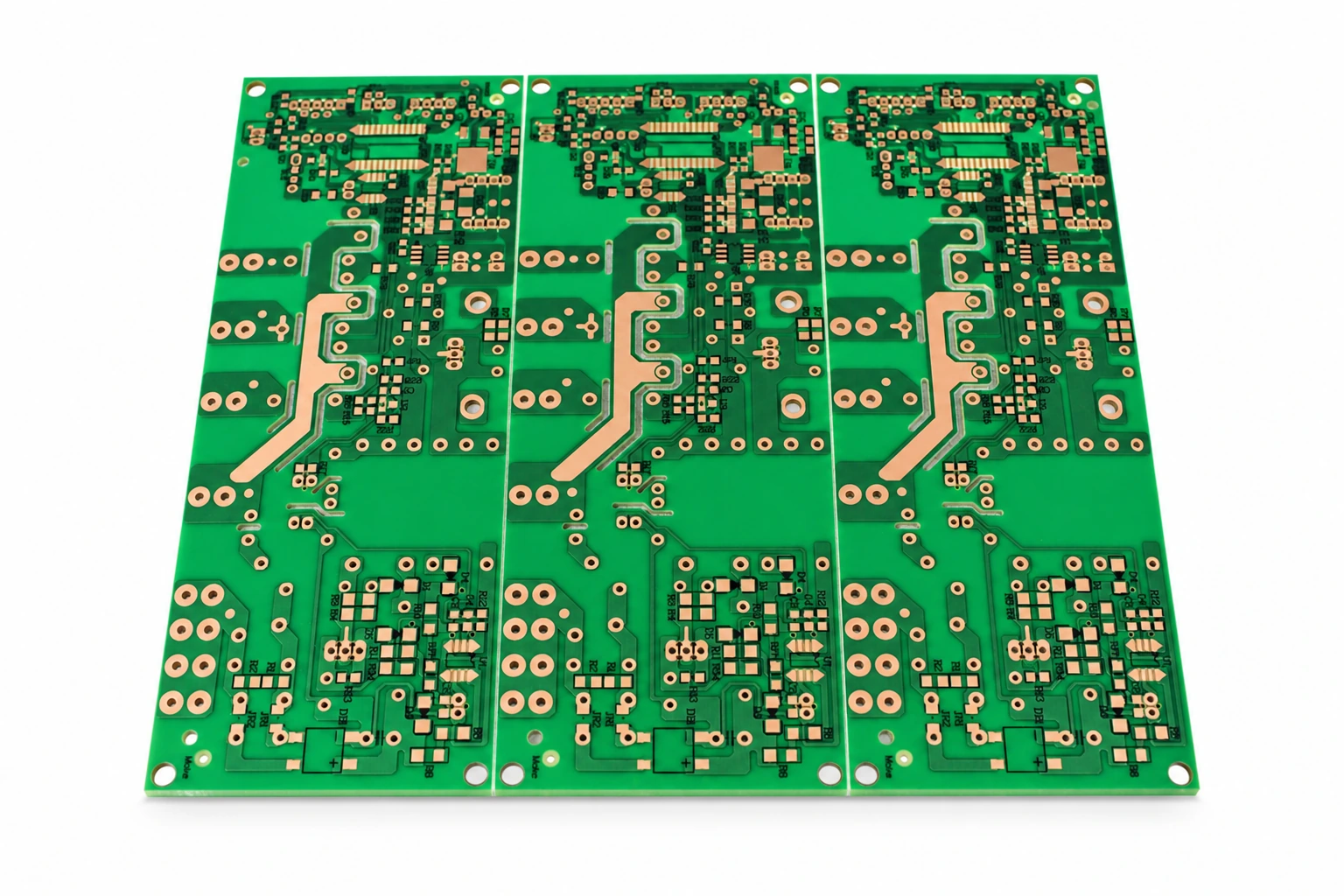 Bare FR-4 PCB panel showing green solder mask and surface-finished pads