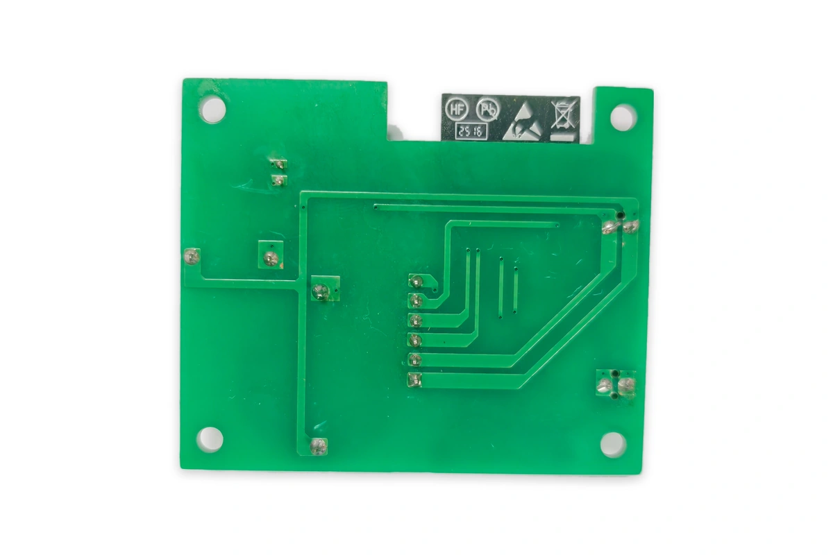 Smart connected home appliance ESP32 IoT control board PCBA rear view with solder joints on pure white background